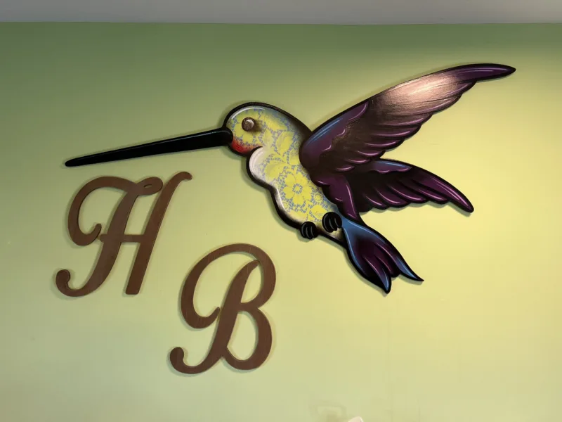 Hummingbird Tattoo Studio interior hummingbird wall art